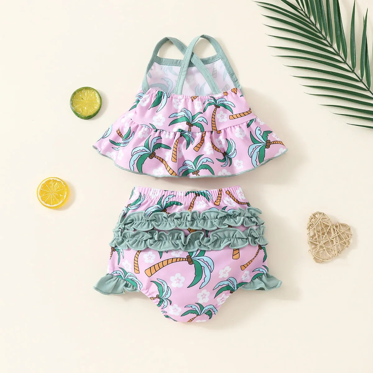 White toddler boy two-piece swimsuit set with shirt and beach shorts on a hanger