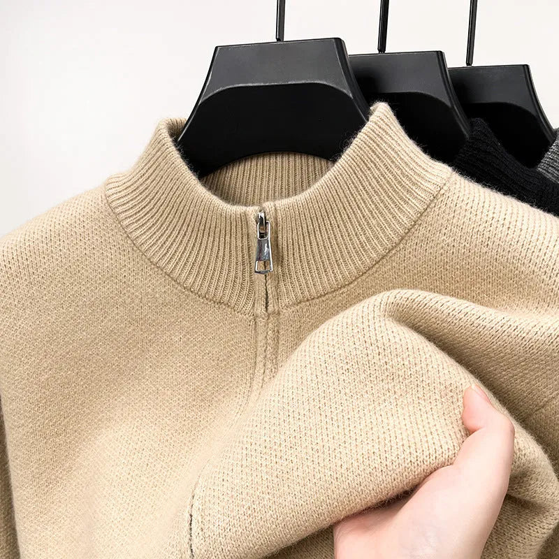 Men's grey knitted zip-up cardigan with high stand collar on hanger
