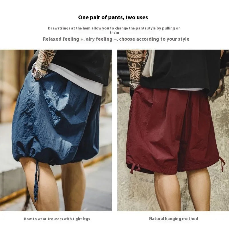 Men's loose-fit Prussian Blue nylon beach shorts with embroidered design on thigh