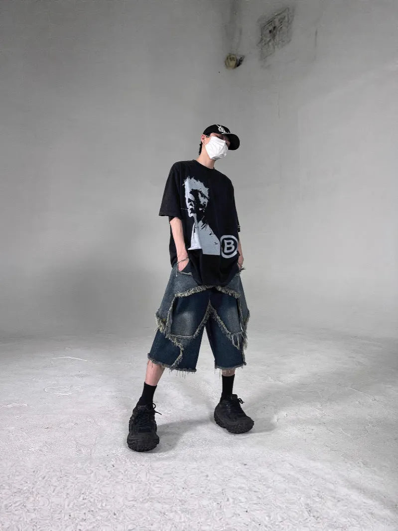 Men's blue denim shorts with five-pointed star embroidery and frayed hem in loose fit style