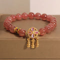 Women's strawberry quartz bracelet with four-leaf clover dream catcher and ball charm pendant