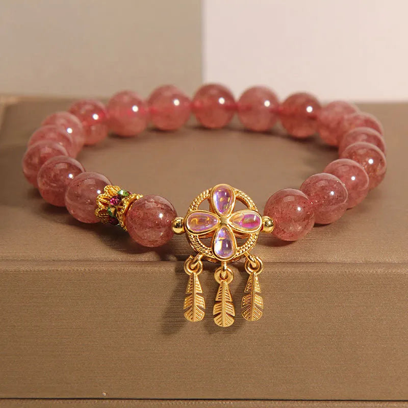 Women's strawberry quartz bracelet with four-leaf clover dream catcher and ball charm pendant
