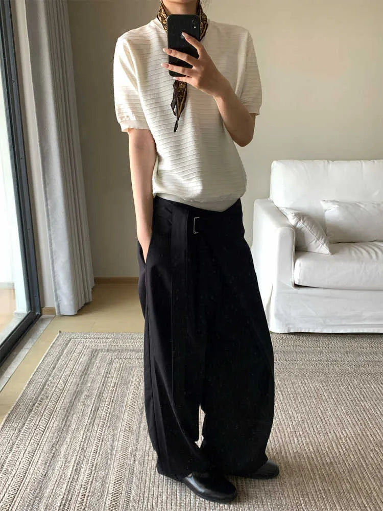 Black women's straight-leg trousers with a single front pleat and adjustable waistband.