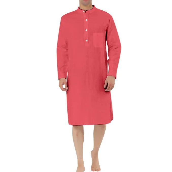 Man wearing a dark blue cotton shirt robe with a button front and chest pocket.