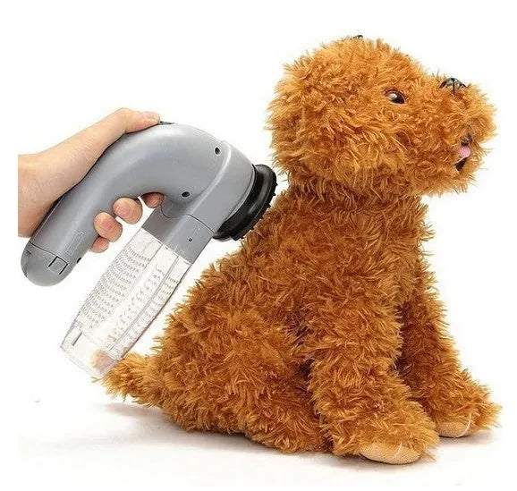 Grey handheld pet hair vacuum cleaner with soft rubber grooming head for dogs and cats