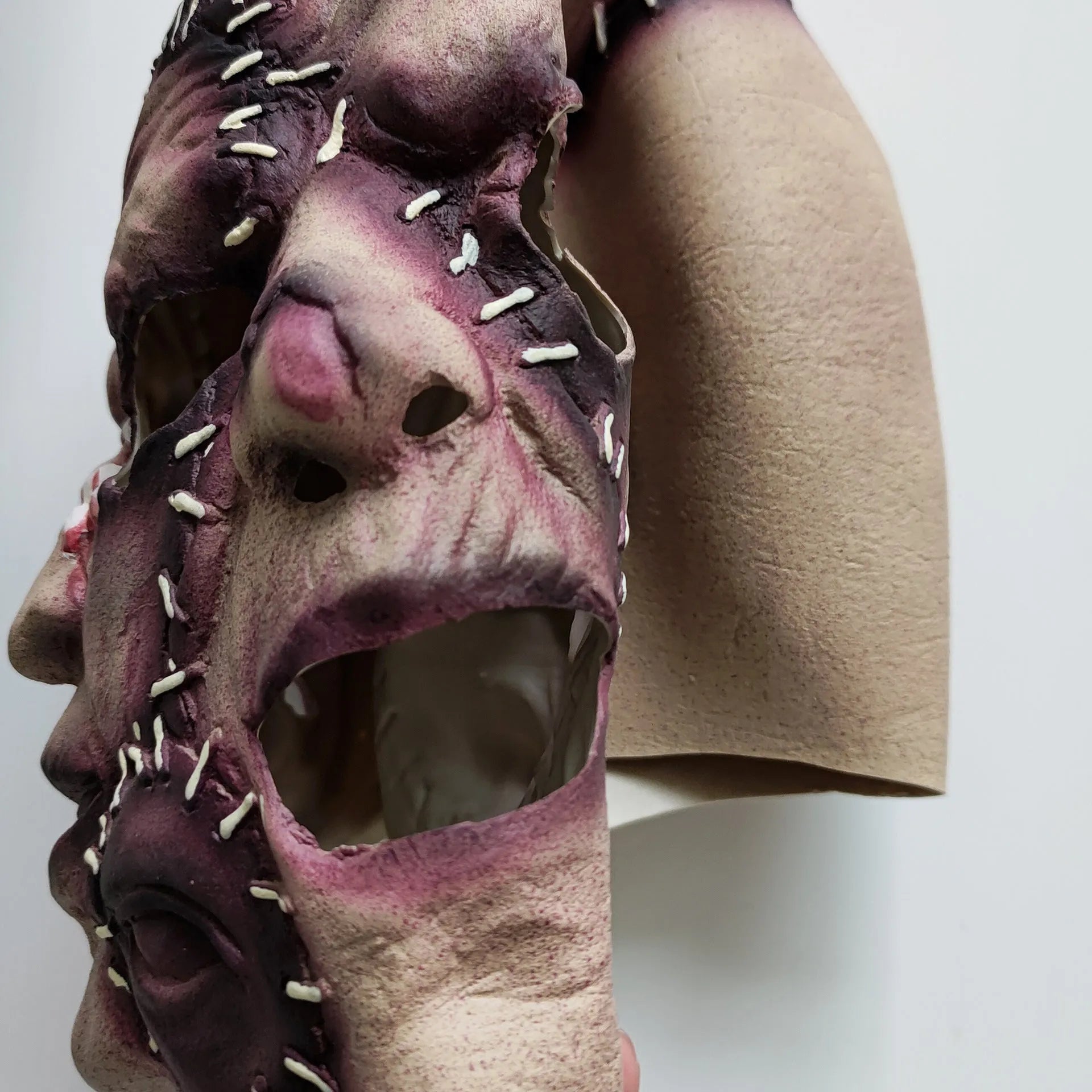 Three-sided grimace horror Halloween mask in natural latex with realistic facial texture