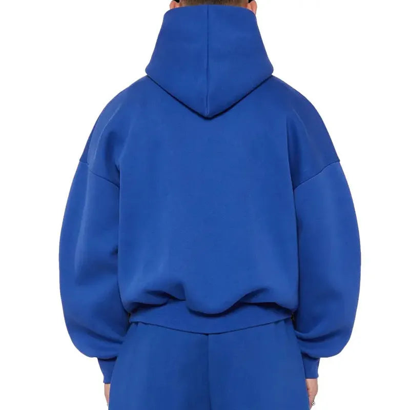 A man wearing a solid colour fleece-lined cotton hoodie with a wool lining.