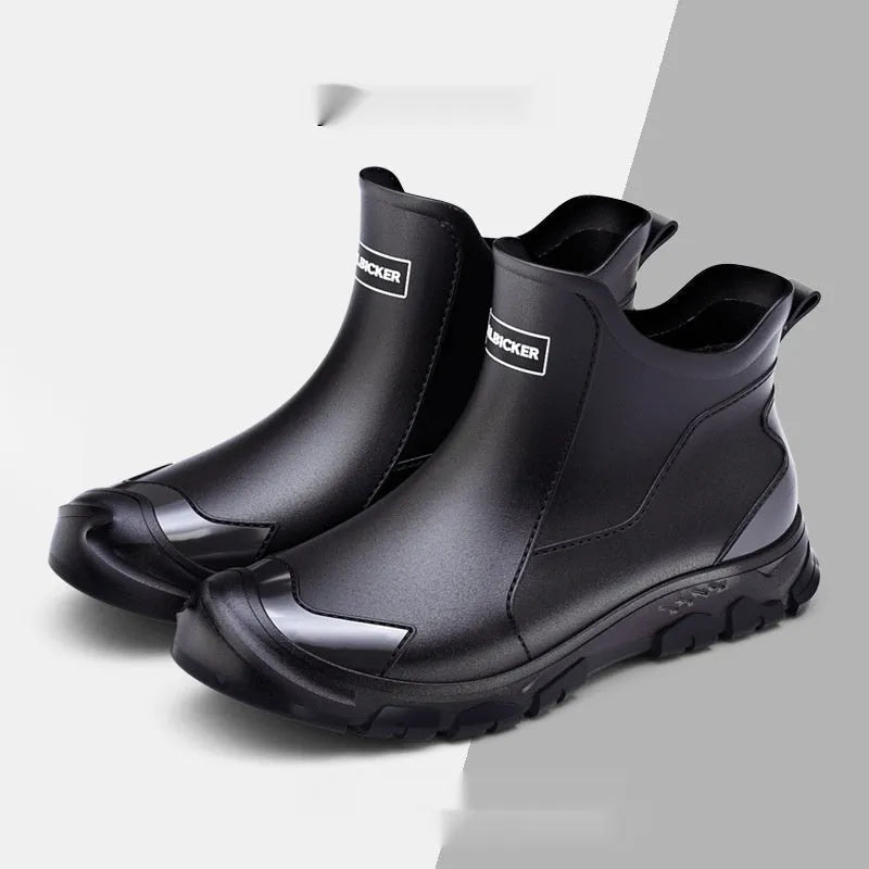 Pair of solid colour low tube PVC wading shoes with a round toe and non-slip plastic sole.