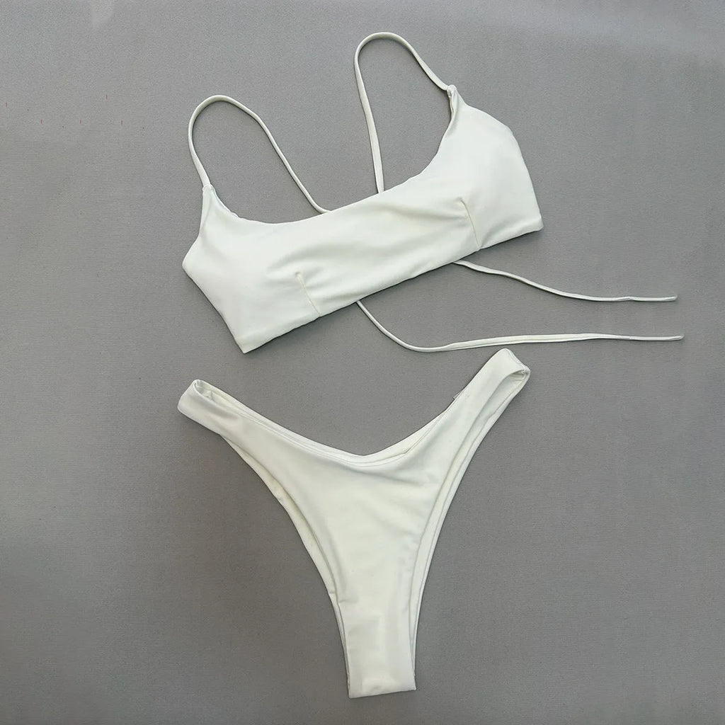 Solid colour split women's swimsuit in nylon, sleeveless one-piece, available in brown, beige, and black