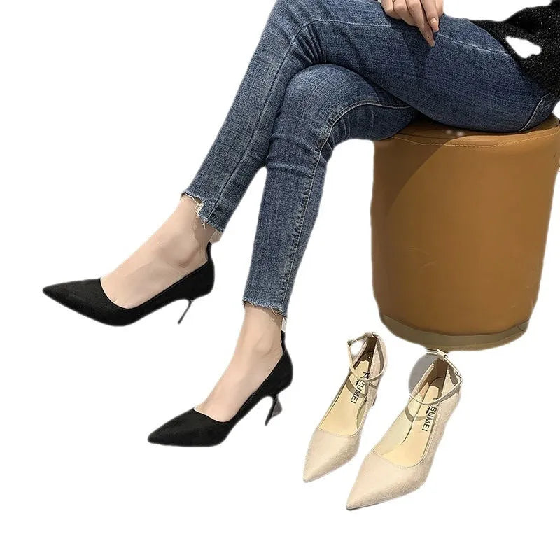 Women's black stiletto heels with skull pattern and buckle detailing on stiletto heel