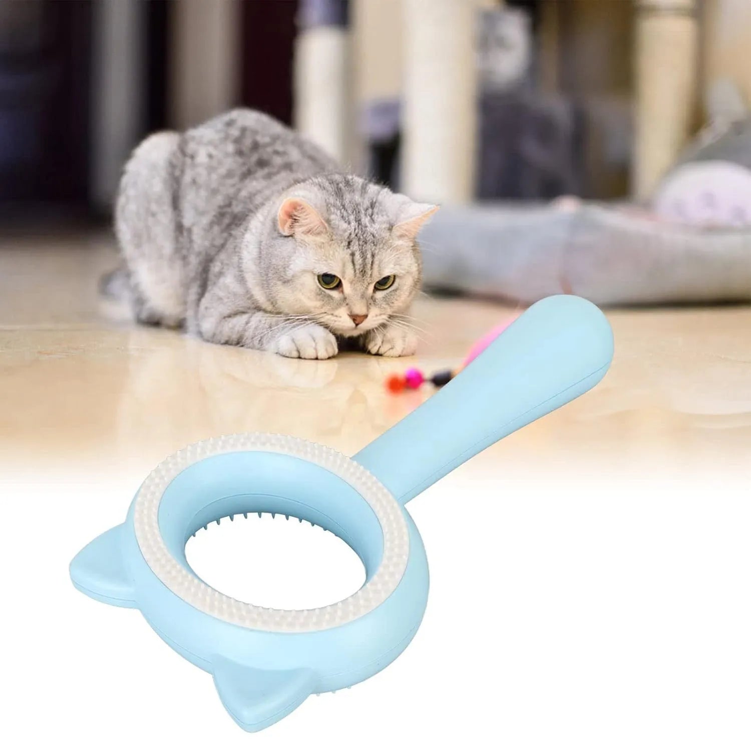 Blue and white double-sided pet grooming brush with an ergonomic handle for cats and dogs.