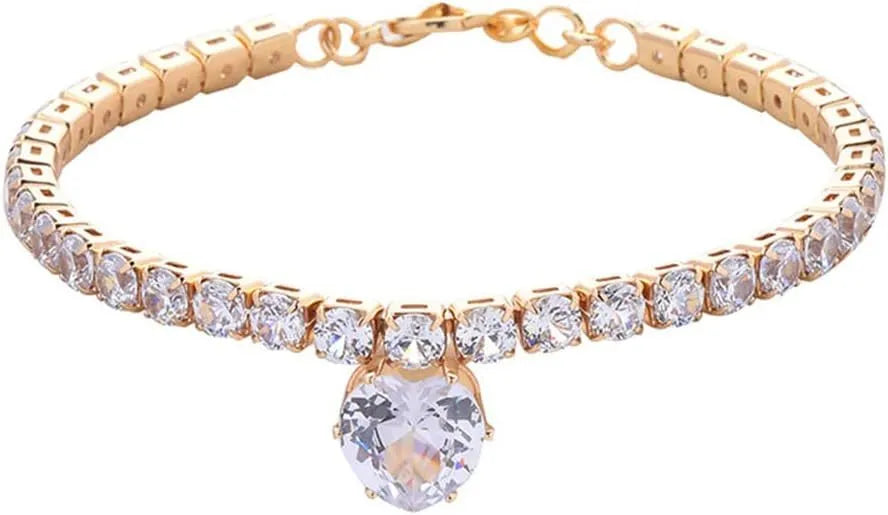 Gold rhinestone heart-shaped dog collar on a white background showing the shiny bling design.