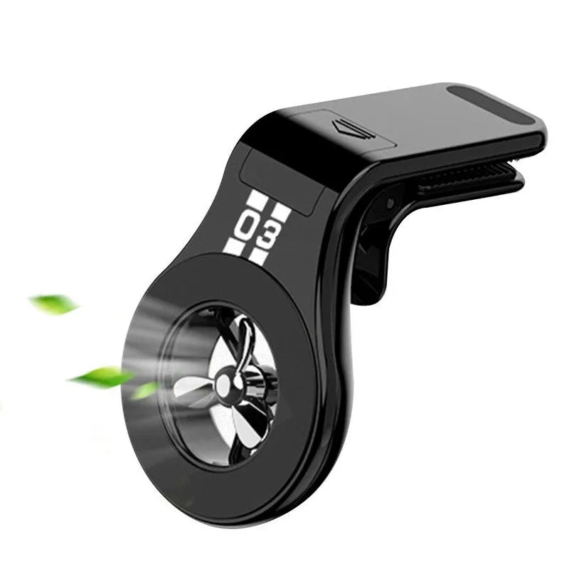 Magnetic car phone holder mounted on air vent with smartphone attached and perfume slices