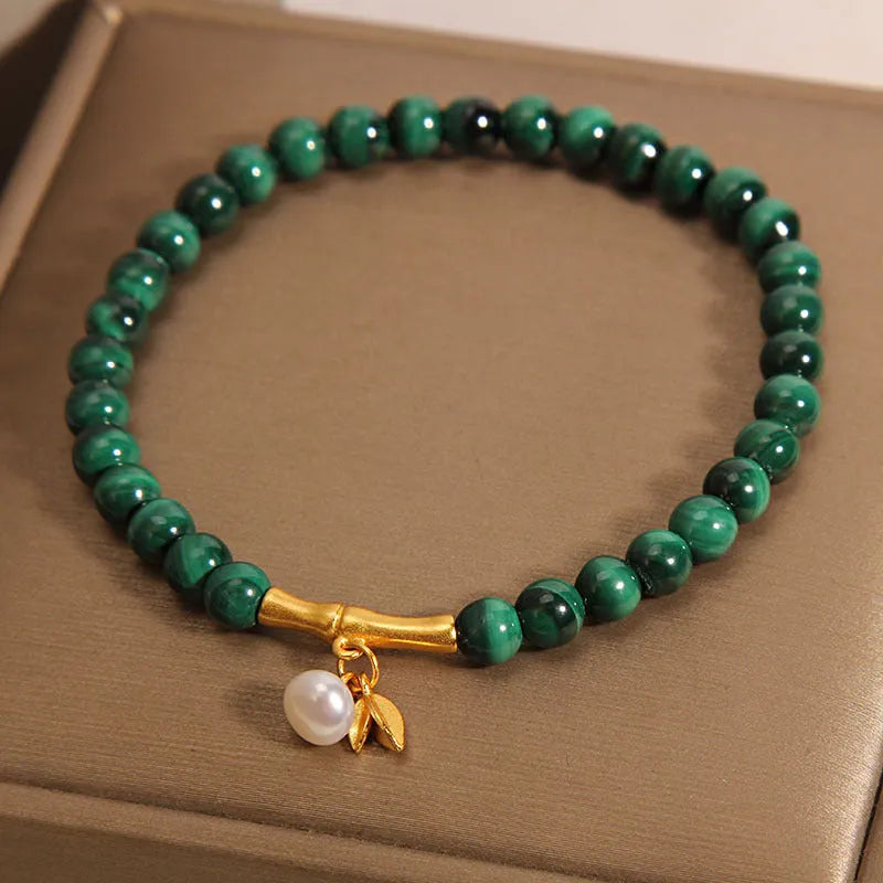 Women's adjustable lucky bamboo bracelet with white crystal detailing on wrist