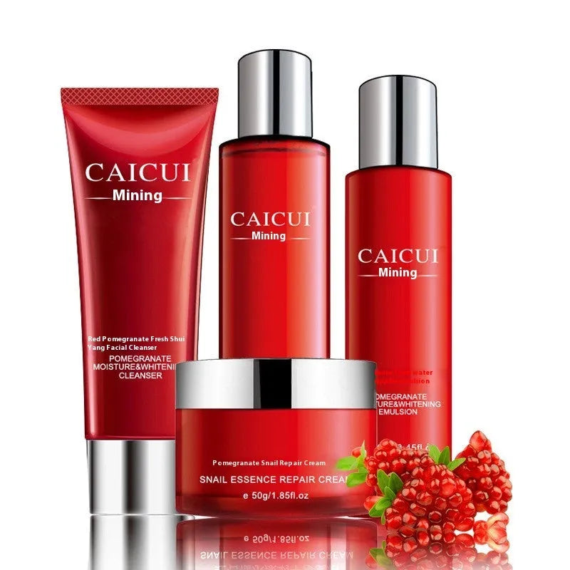 Pomegranate skincare set with four products: face wash, toner, lotion and facial cream in red packaging