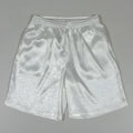 Man wearing black Tang suit style elastic waist shorts for martial arts training.