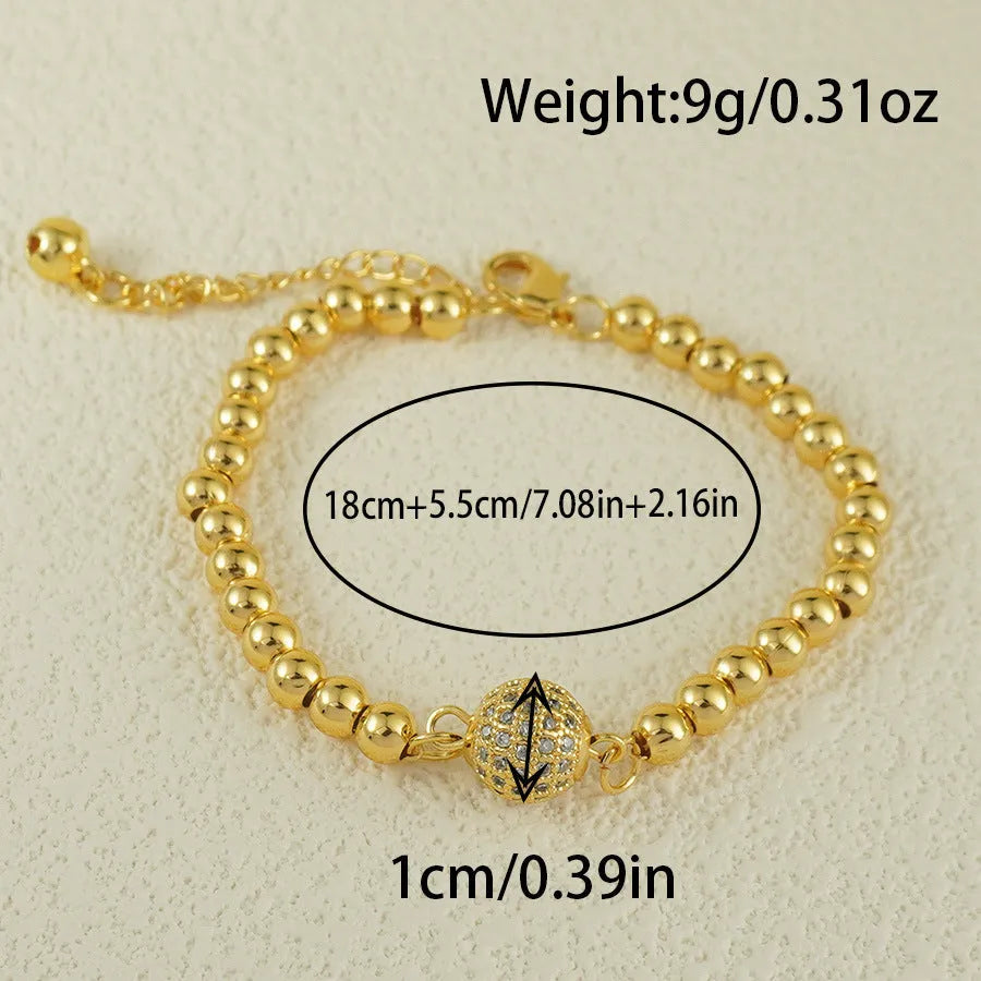 Copper bracelet with heart-shaped Arabic design and single zircon centrepiece on white background