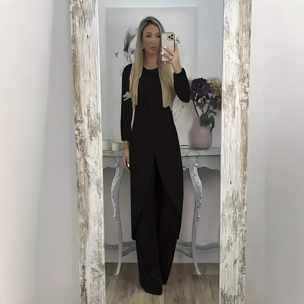 Casual long sleeve top and trousers lounge set in black, shown on a hanger