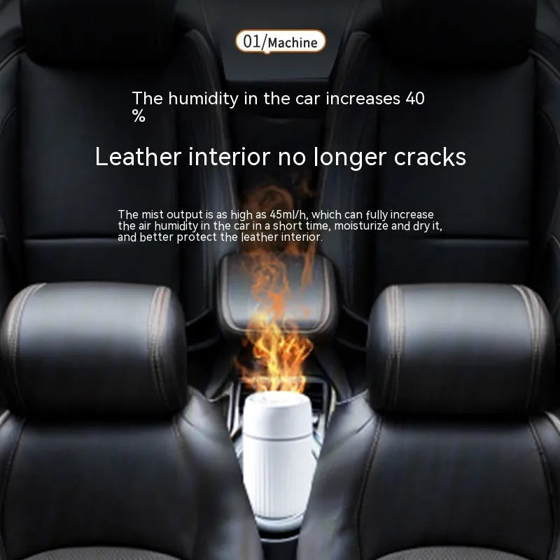 Car aroma diffuser with simulated flame effect showing black unit with mist output