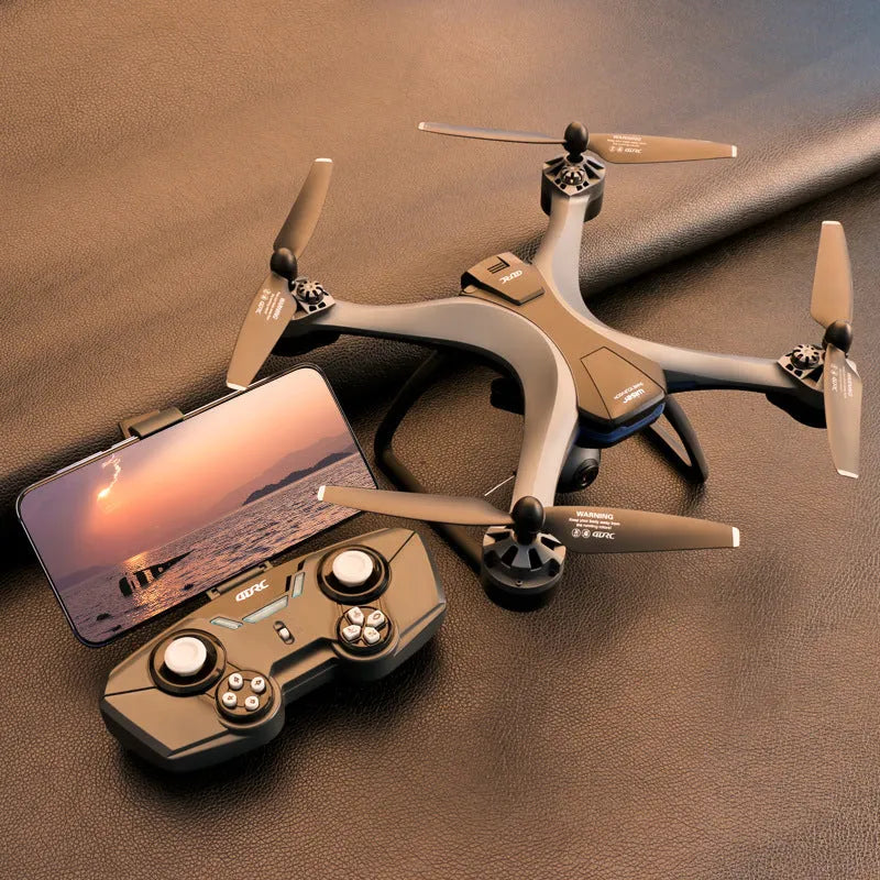 Black quadrocopter drone with four rotors, GPS module, dual cameras, and a 6-channel handheld remote controller.