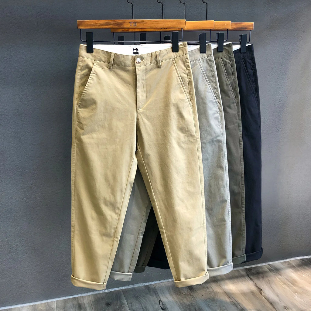 Men's cropped pure cotton casual pants in green, with mid waist and zipper fly.