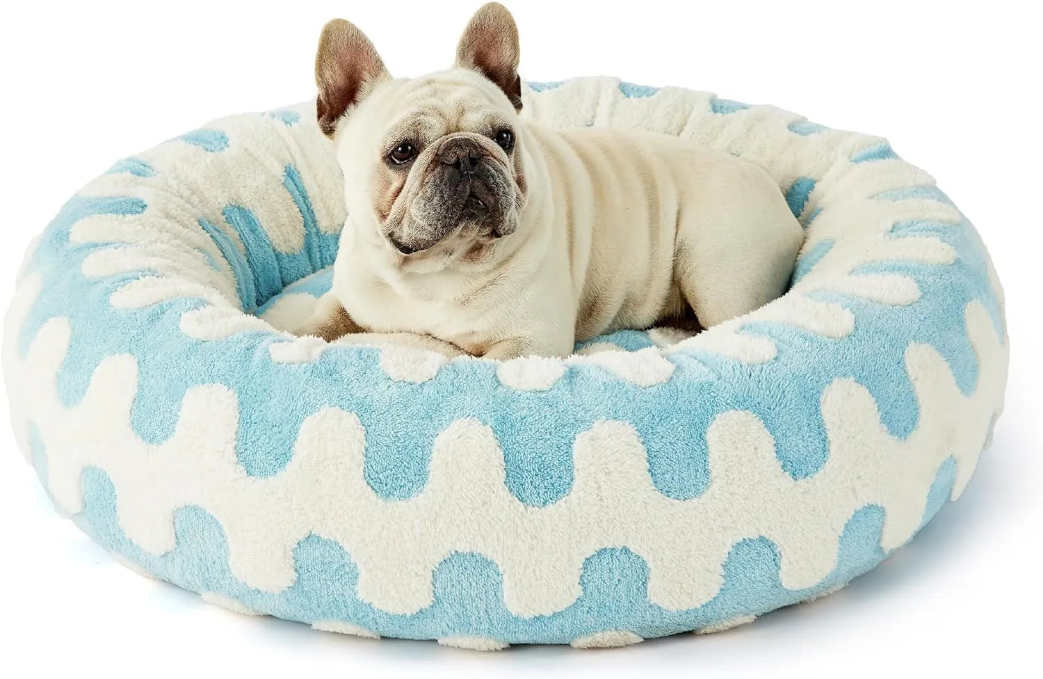 Round blue and white plaid dog bed with a removable cover on a plastic base