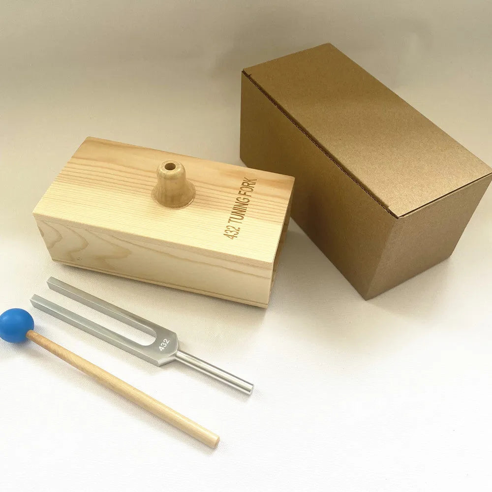Aluminium alloy 432Hz tuning fork and speaker set on kraft paper box