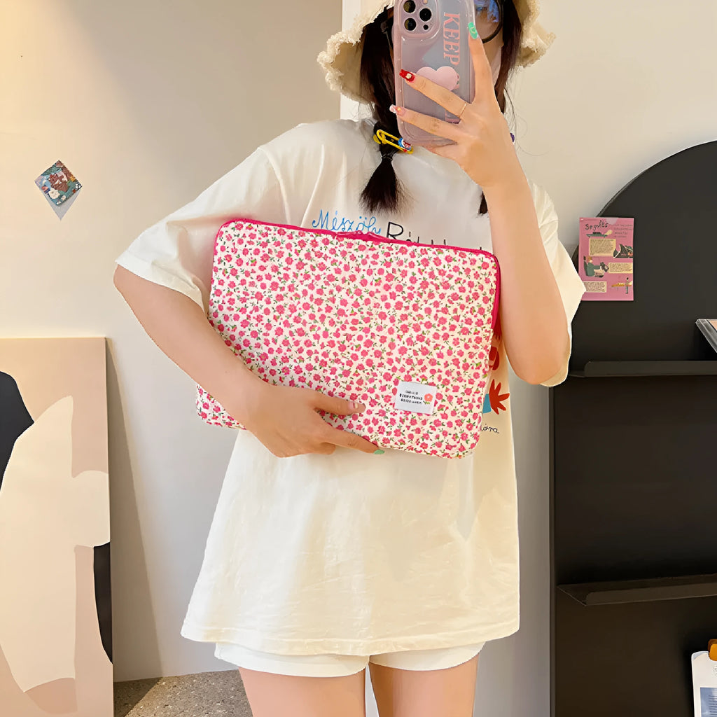 Cloth laptop bag in floral and heart patterns showing three size options with anti-seismic protection