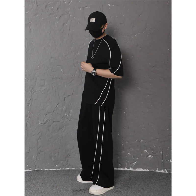 Summer women's sporty casual two-piece set in black suit with colour-blocking trim, short sleeve top and long pants
