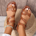 Women's flat sandals with velcro strap showing round toe design and rubber sole