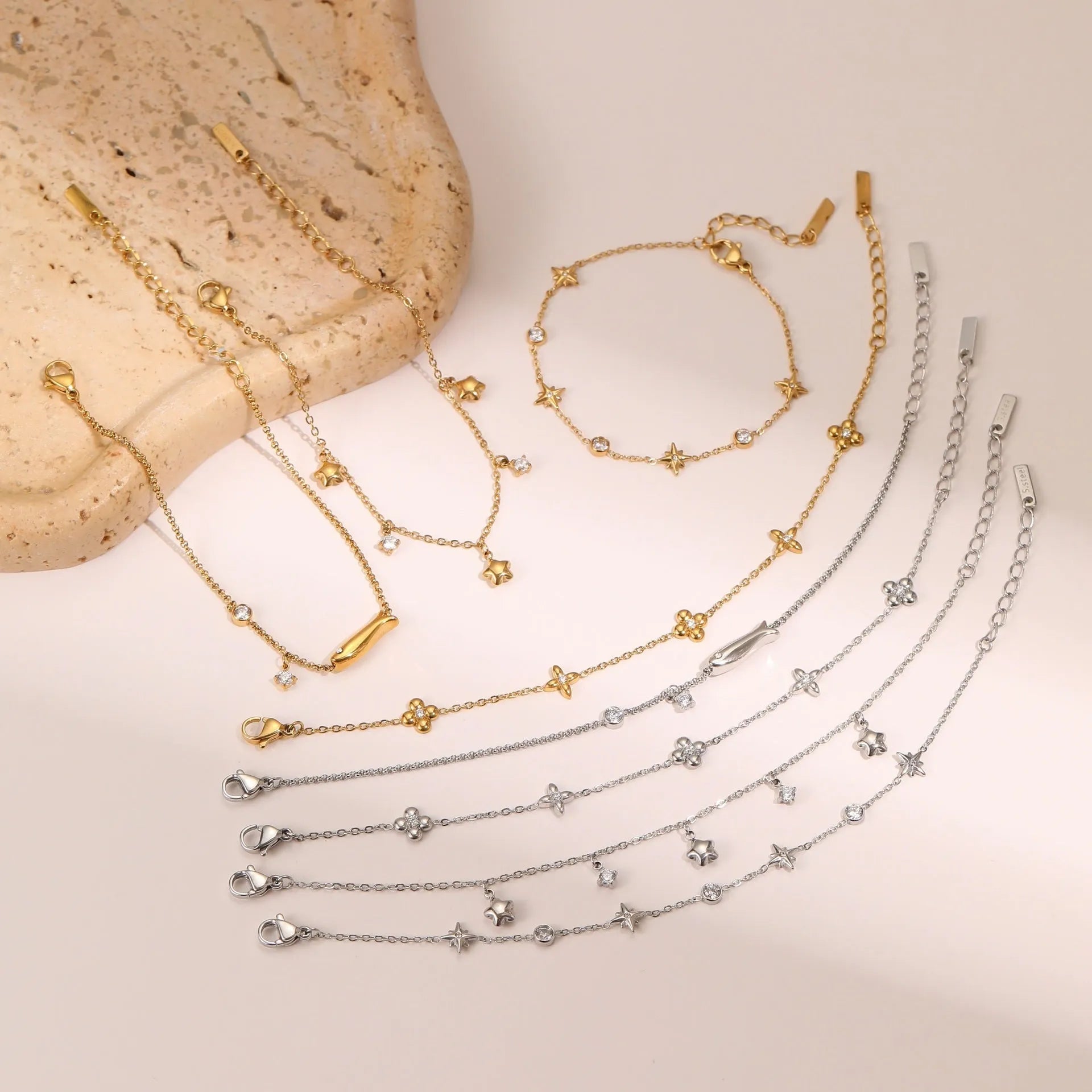 Ins women's stainless steel bracelet with 18K gold plating and a geometric star-shaped pendant.