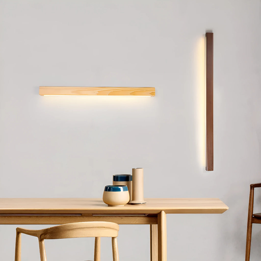 Walnut colour wooden log design LED strip wall lamp in three lengths on a modern wall.