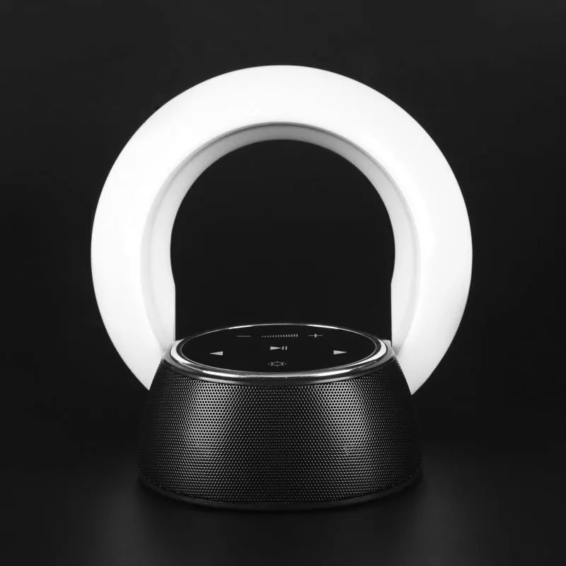 Folding Bluetooth speaker desk lamp with touch controls showing white, yellow, and blue LED lighting options