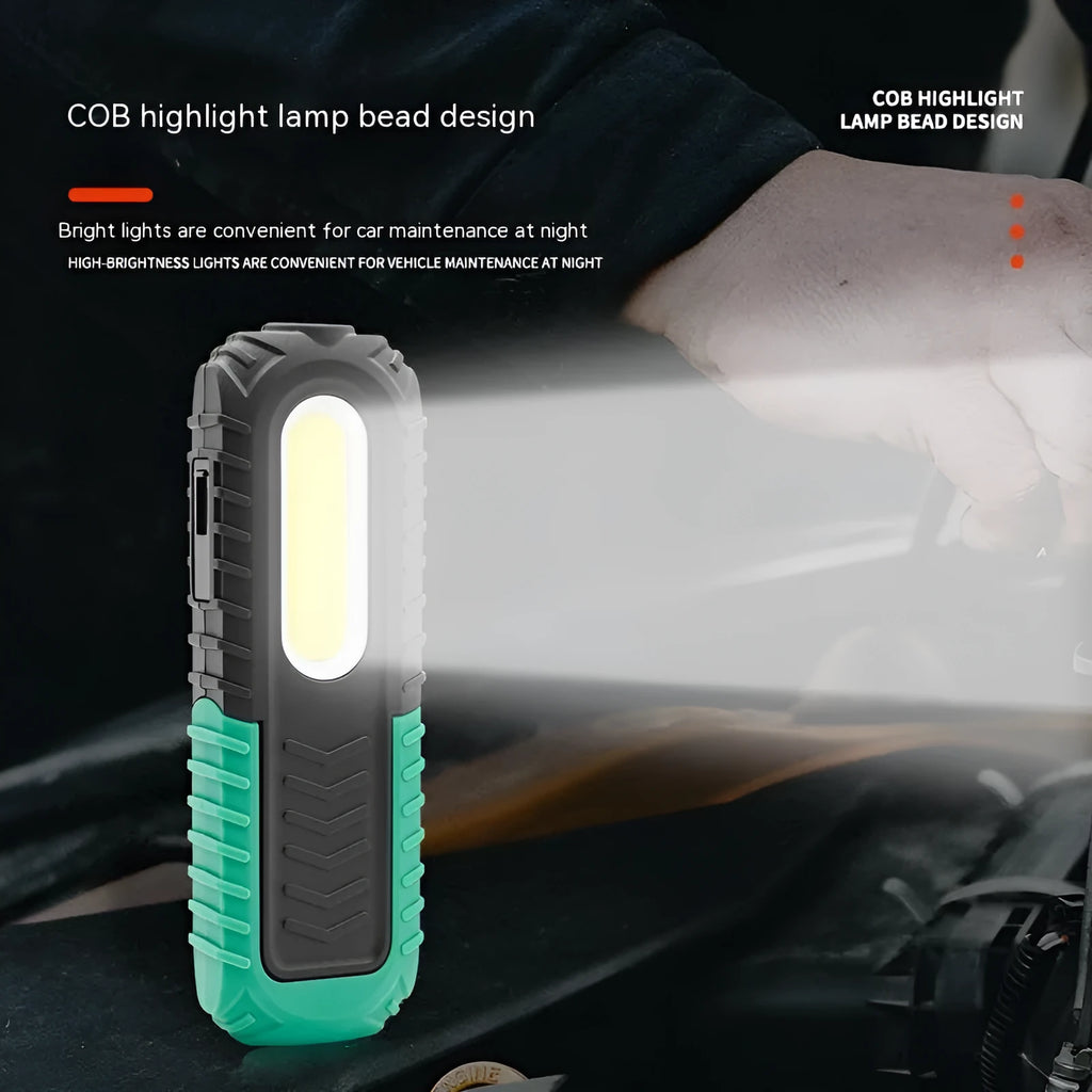 Black and green USB auto repair work light with compact design for workshop use