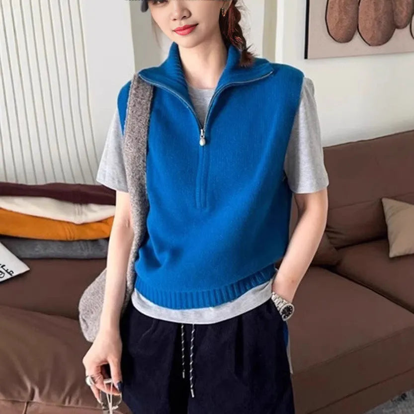 Retro half-zip sleeveless knitted vest in mesh polyester shown in a solid colour with a 3D texture.