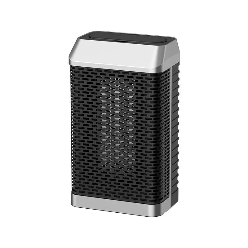 Black remote control desktop heater with oscillating louvres on a wooden desk.