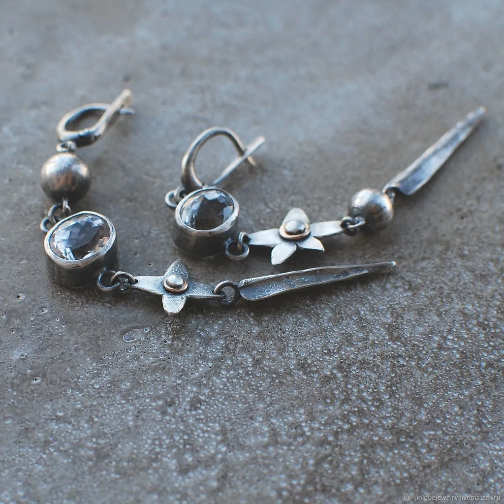 Geometric xingx design pendant earrings with rhinestone accents in antique silver finish