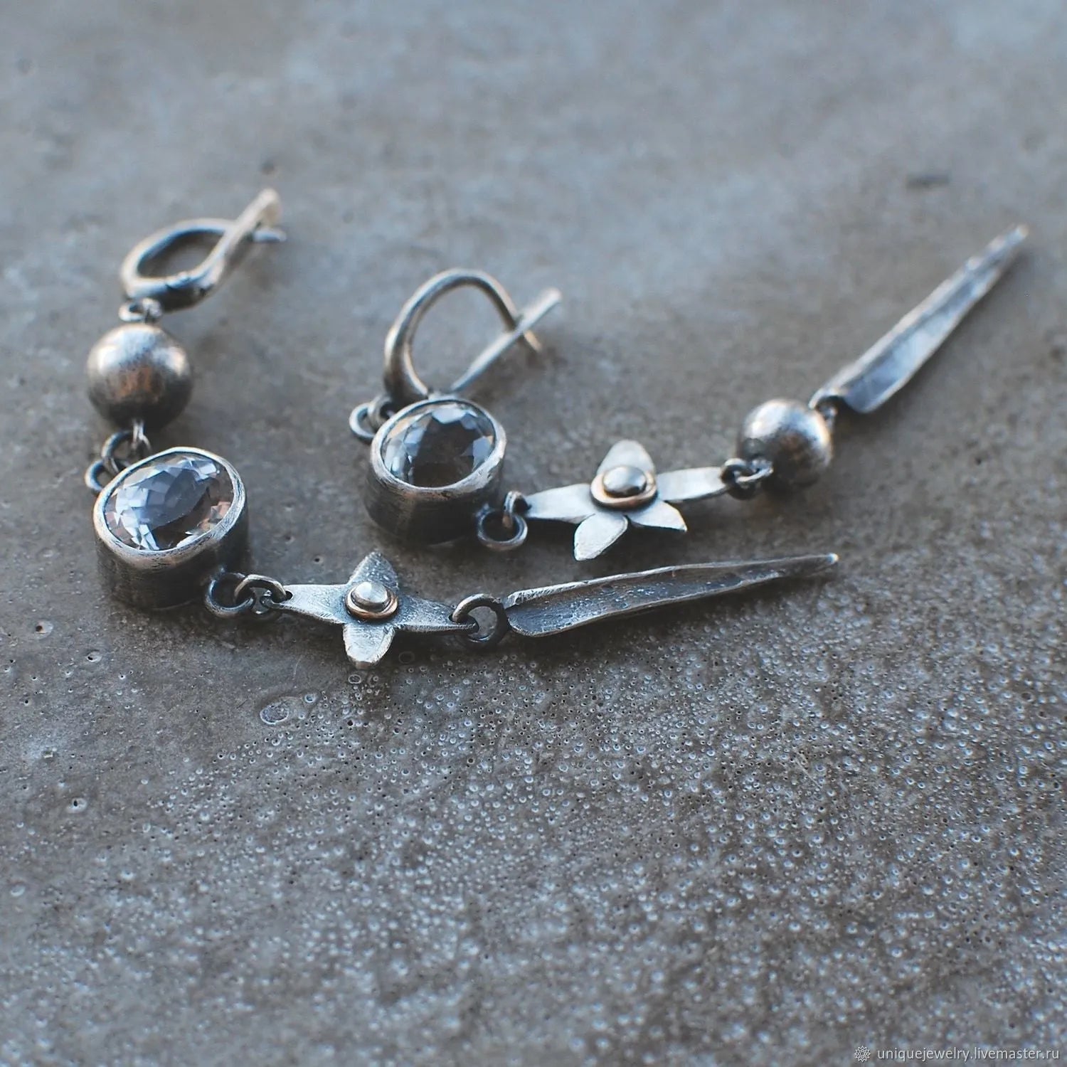 Geometric xingx design pendant earrings with rhinestone accents in antique silver finish
