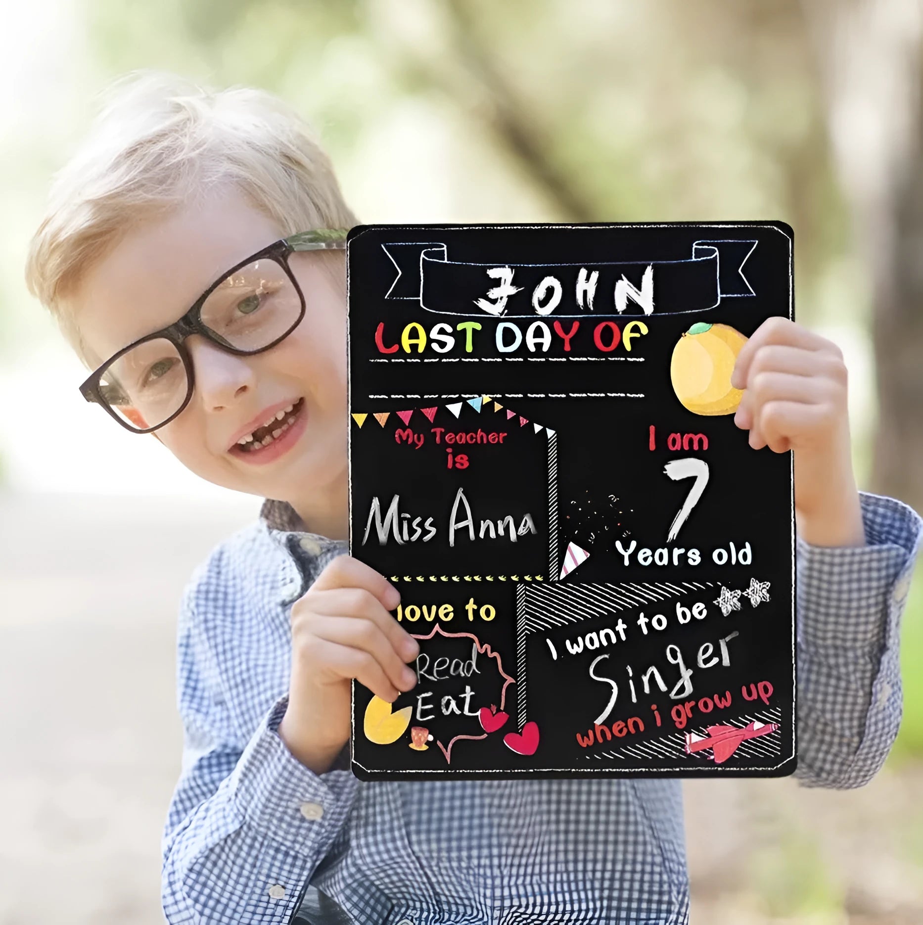 White modern wooden first day of school blackboard sign on a table.