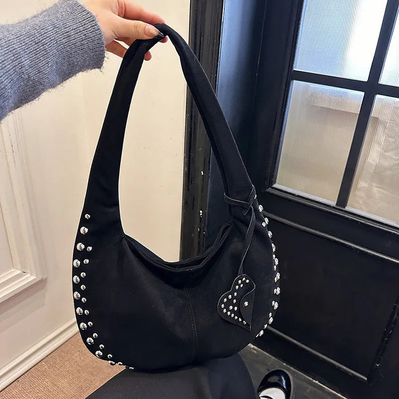 Soft plush underarm tote handbag in retro style showing black colour variant
