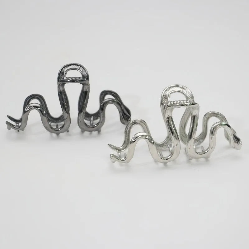 Slytherin serpentine metal hair barrette in silver or gun black finish measuring 10.5cm