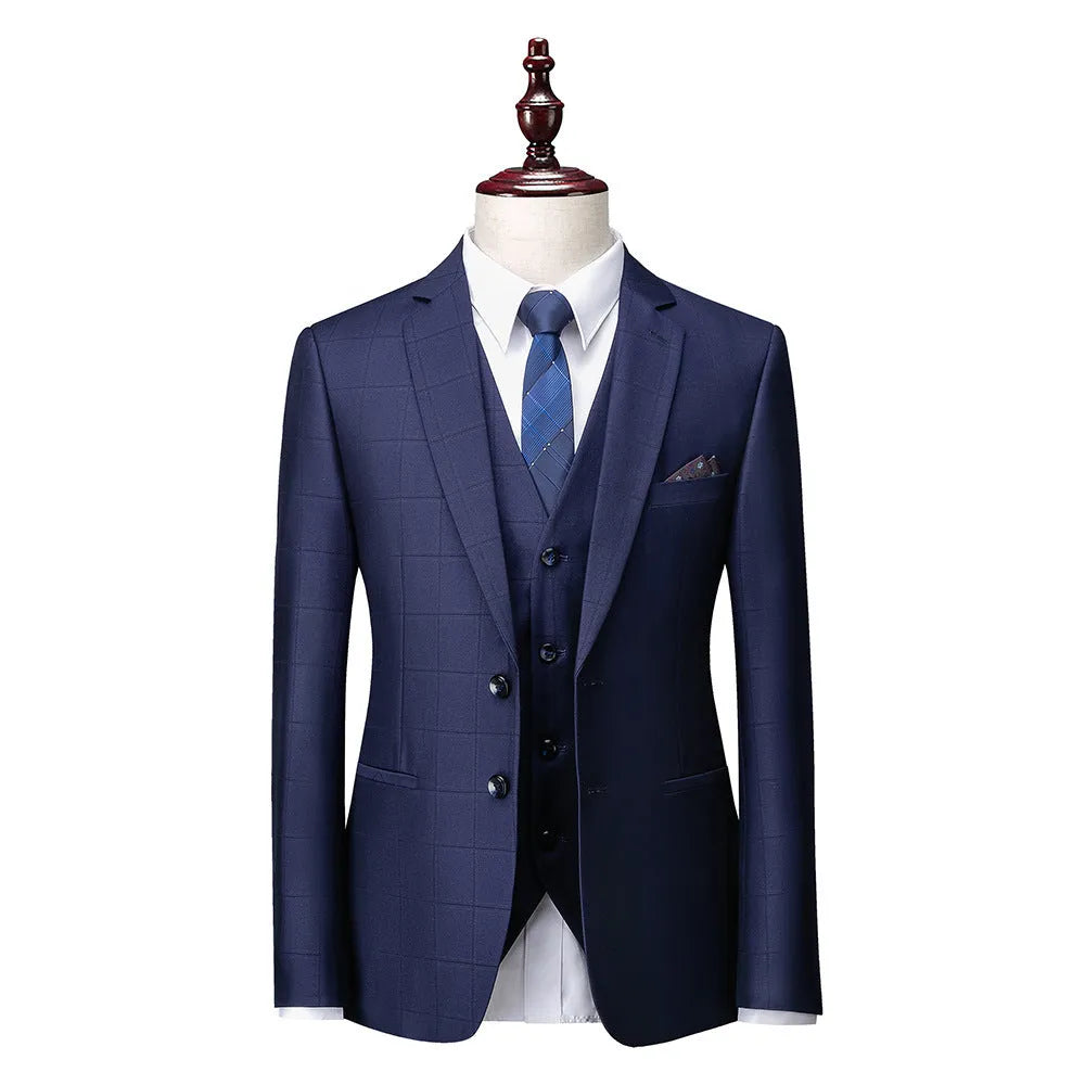 Men's navy blue slim fit three-piece suit with jacket, vest, and trousers on a hanger.