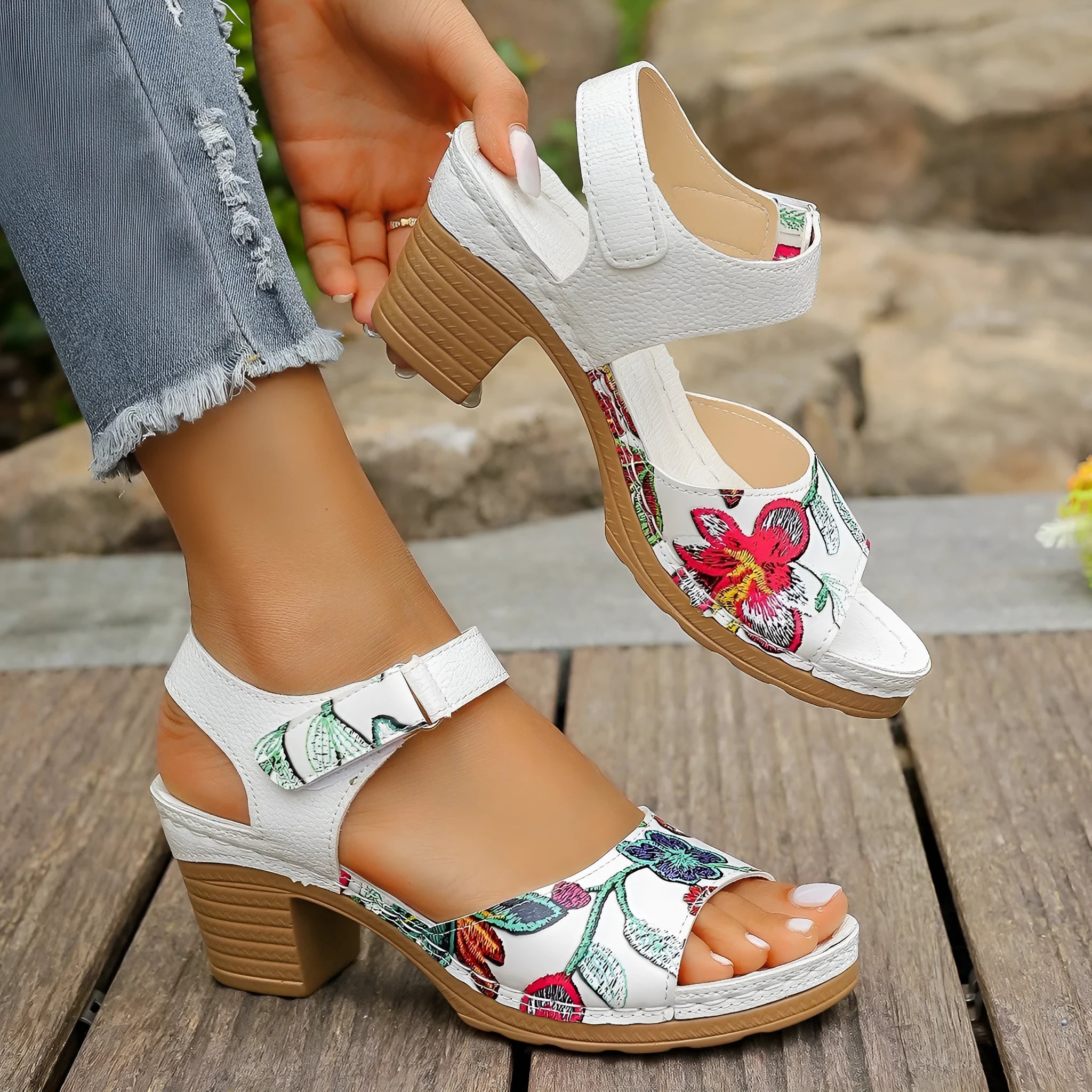 White women's high heel sandals with Velcro buckle fastening showing PU upper and rubber sole