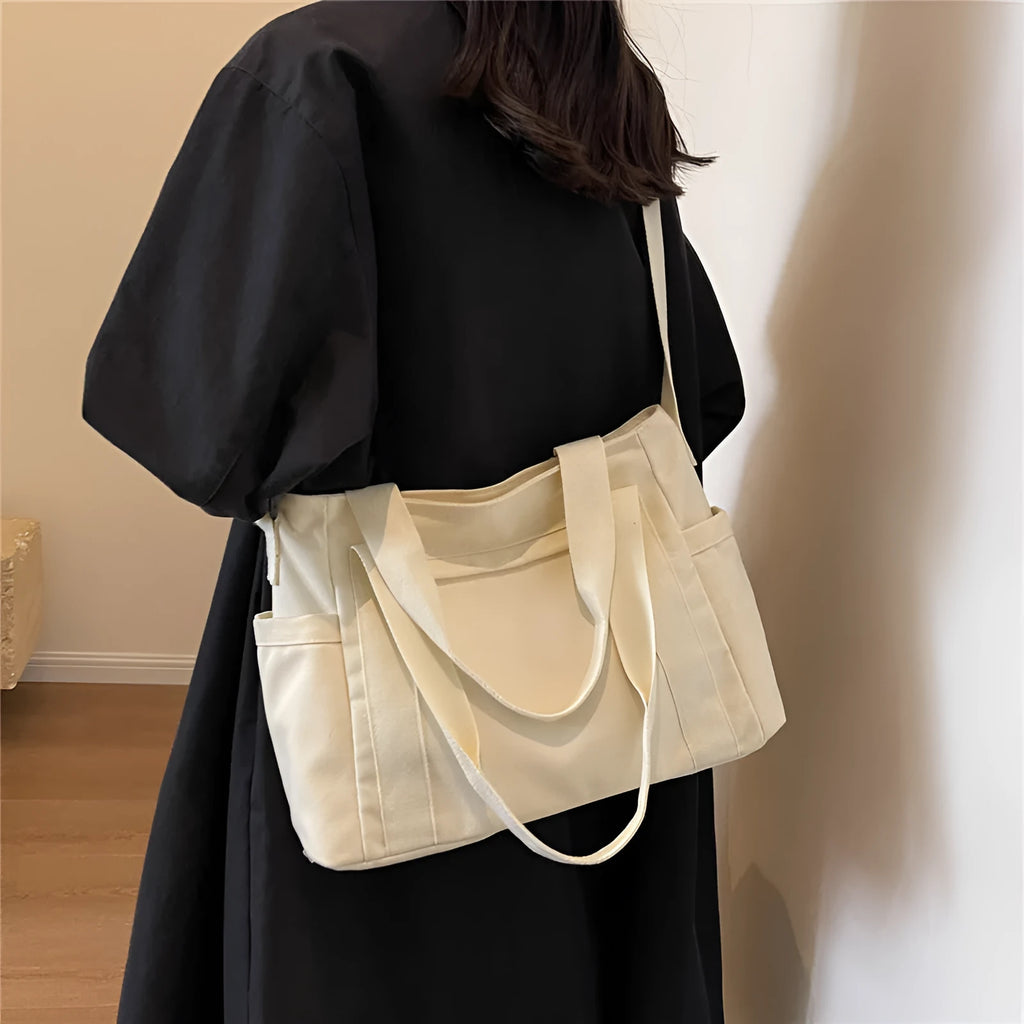 Large capacity polyester canvas shoulder bag in solid colour with sandwich pocket