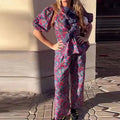 Leisure floral printed tie-neck trousers suit with puff sleeves, shown in picture colour.