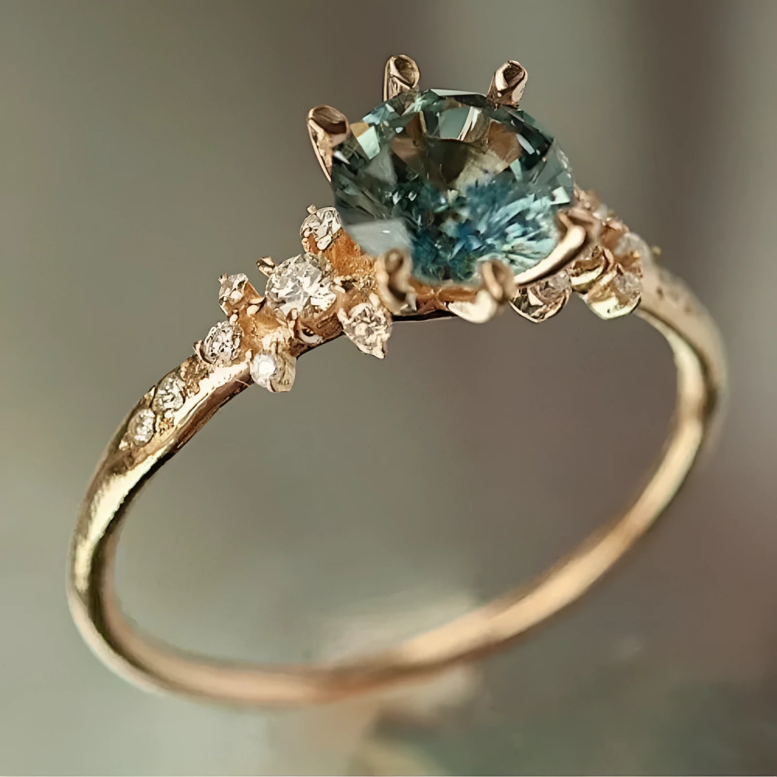 Creative geometric gold plated ring with claw-set zircon stone on a hand.