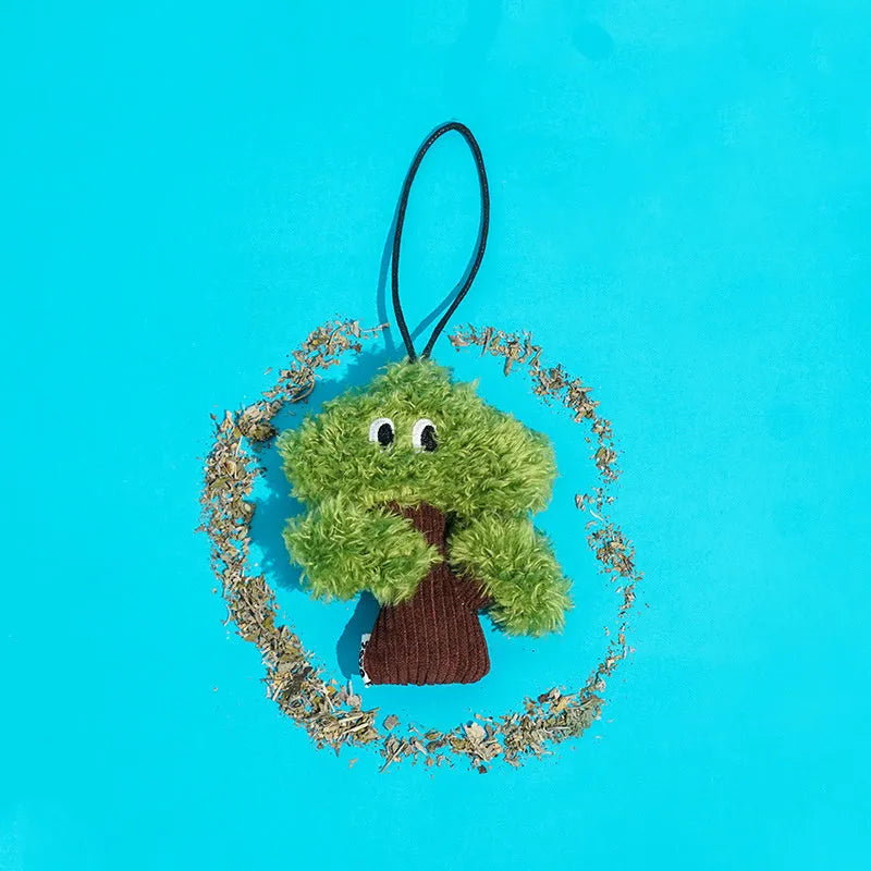 Pine tree-shaped cat mint toy bag pendant and a separate cat tease stick on a white background