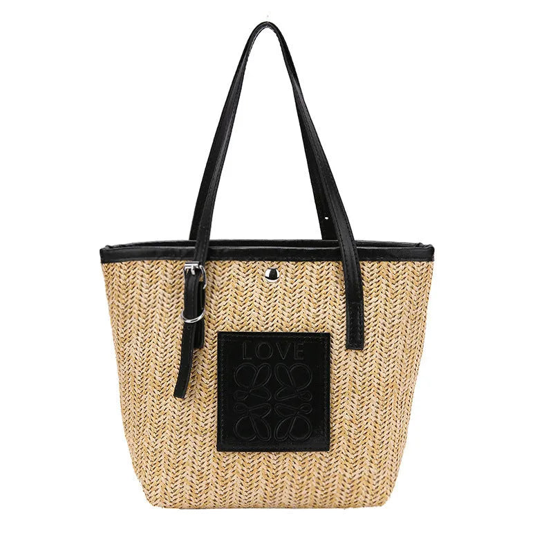 Straw woven women's shoulder bag in black with three-dimensional pockets and 27cm width