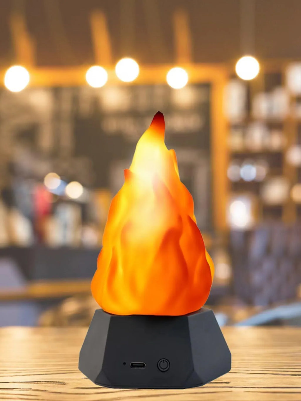 Flame-shaped decorative night light with black charging base for indoor and outdoor use