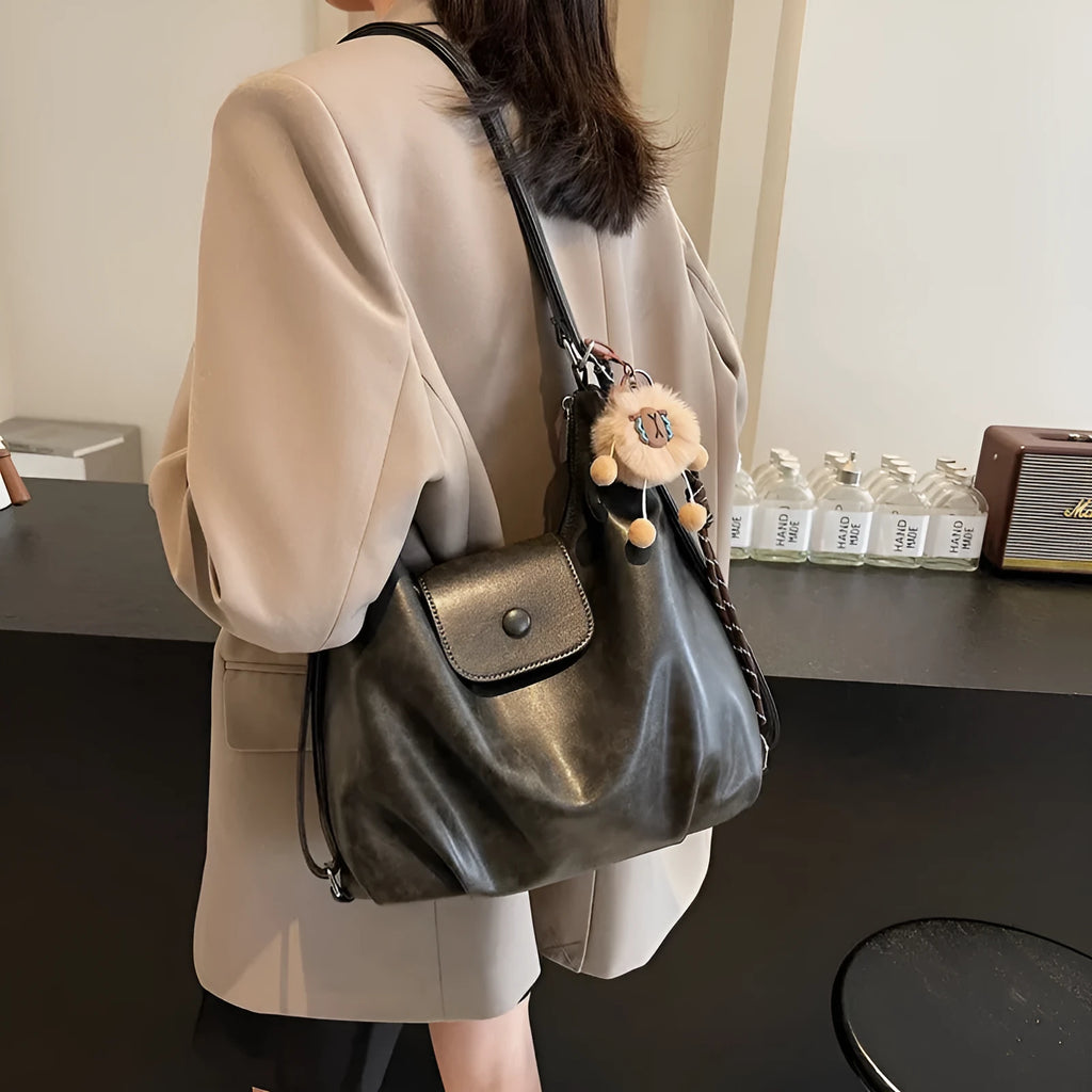 Leather women's shoulder bag in brown colour with single strap and structured horizontal design
